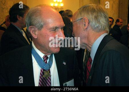 US Navy 0703220000X-001 Deputy Defense Secretary Gordon England talks with Medal of Honor recipient Thomas Hudner at a ceremony honoring recipients of the nation's highest military award for bravery.jpg Stock Photo