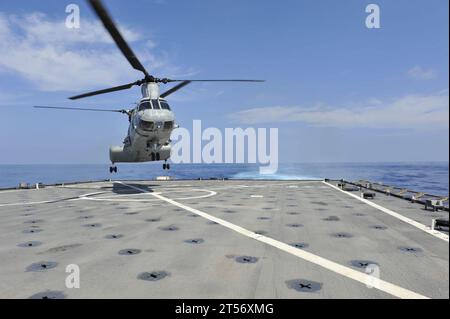 US Navy A CH-46 Sea Knight helicopter from Marine Medium Helicopter Squadron (HMM) 268 Reinforced, prepares to land on the fligh.jpg Stock Photo