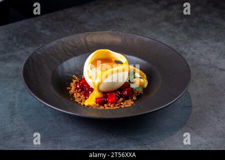 signature frozen tropical dessert on a dark background side view Stock Photo