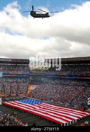 US Navy A Hawaii Army National Guard CH-47 Chinook helicopter flies above Aloha Stadium during the national anthem during pre-game ceremonies for the 2008 NFL Pro Bowl.jpg Stock Photo