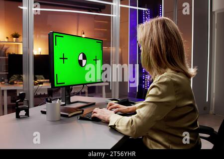 Girl in the Office Using Laptop for Online Computer Work Stock Photo