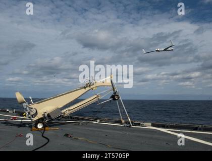 US Navy A Scan Eagle unmanned aerial vehicle (UAV) is launched from the flight deck for simulated reconnaissance aboard the Whid.jpg Stock Photo