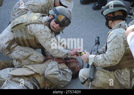 US Navy Hospital corpsmen participating in the Tactical Combat Casualty Course at Naval Medical Center San Diego (NMCSD) treat c.jpg Stock Photo