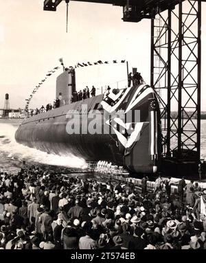 US Navy In this file  taken Jan. 21, 1954, the nuclear-powered submarine USS Nautilus (SSN 571) slips into the Thames River.jpg Stock Photo