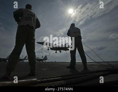 US Navy Landing signal officers guide pilots to safe recoveries aboard the Nimitz-class aircraft carrier USS Carl Vinson (CVN 70.jpg Stock Photo