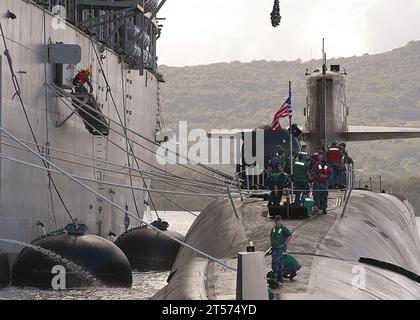 US Navy Line handlers aboard the Ohio-class guided-missile submarine USS Michigan (SSGN 727) prepare to moor alongside the subma.jpg Stock Photo