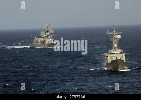 US Navy Royal Australian Navy guided-missile frigate HMAS Adelaide (FFG 01) and Japan Maritime Self-Defense Force destroyer JS Oonami (DD 111) perform maneuvers during Malabar 2007.jpg Stock Photo