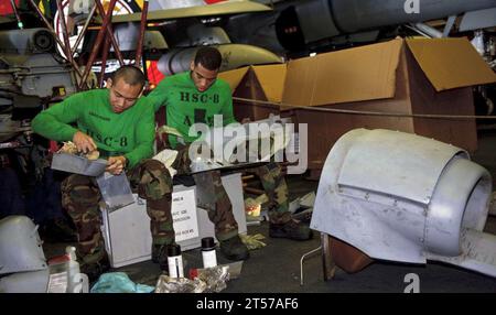 US Navy Sailors wipe down airframe panels.jpg Stock Photo