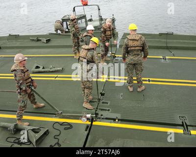 US Navy Seabees from Naval Mobile Construction Battalion (NMCB) 133 and Marines from the 8th Engineering Support Battalion (ESB).jpg Stock Photo