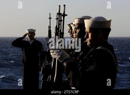 US Navy The rifle detail aboard the Nimitz-class aircraft carrier USS Carl Vinson (CVN 70) presents arms during a burial at sea.jpg Stock Photo