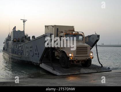 US Navy Vehicles are offloaded from a landing craft utility (LCU) assigned to Assault Craft Unit (ACU) 4 during amphibious operations with the amphibious dock landing ship USS Carter Hall (LSD 50).jpg Stock Photo