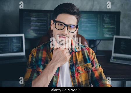 Photo of smart successful web designer sitting chair hand touch chin brainstorming ponder modern business center indoors Stock Photo