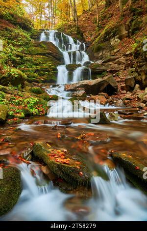 Beautiful Waterfall Shipot in the autumn forest of the Carpathian Mountains Stock Photo