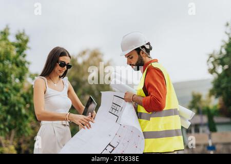 Corporate Architects Discussing Sustainable Design and Planning Profitable Urban Project Stock Photo