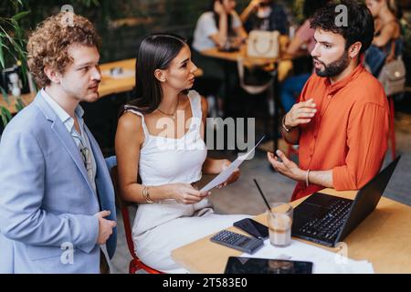 Collaborative Analysis: Architects and Engineers Discussing Sustainable Design and Urban Planning for New Project Stock Photo