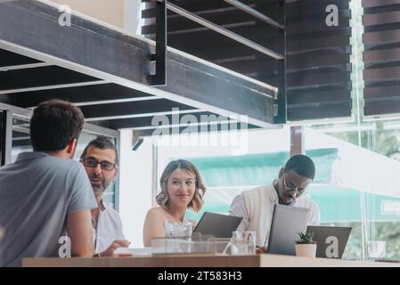 Efficient Business Team Analyzing Reports and Planning for Future Success Stock Photo