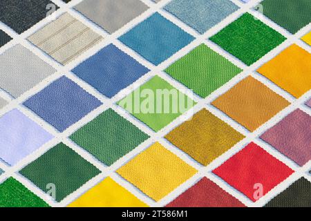 An organized display of fabric swatches in various shades arranged color-wise on a board. Perfect for designers or decorators seeking color inspiratio Stock Photo