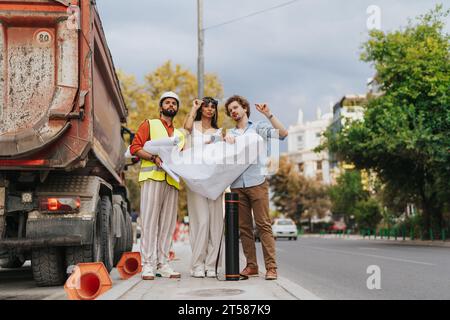 Collaborative Urban Planning and Design: Architects and Engineers Discussing Sustainable Project Blueprint Outdoors Stock Photo