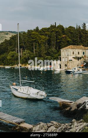 Amazing view of Dubrovnik and the boat in a sea on a sunny day. Travel destination in Croatia. Stock Photo