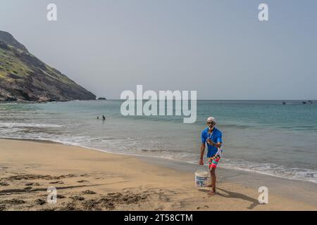 Sao Vicente , Cabo Verde - October 08.2023: Tourist guide at the turtle beach in Sao Pedro on Sao Vicente Island, Cape Verde Stock Photo