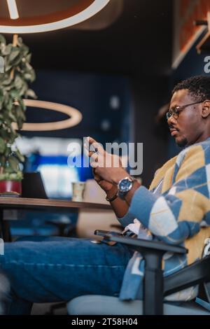 Confident adult in modern office gathering information, analyzing market data. Multiracial colleagues collaborate, discuss investing strategies. Stock Photo