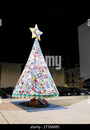 Decorative Christmas tree made of crochet with threads of many colors Stock Photo