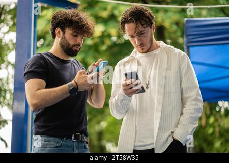 Students reviewing subject before exam at the university quad. Stock Photo