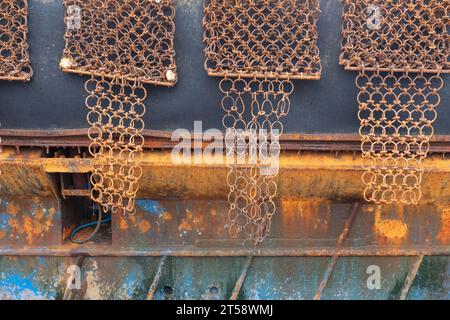 Another side view of a scallop dredging fishing boat showing the heavy duty metal framed nets called scallop dredges, Kirkcudbright, Scotland. Stock Photo