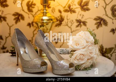 Bridal Heels and Bouquet on a table Stock Photo