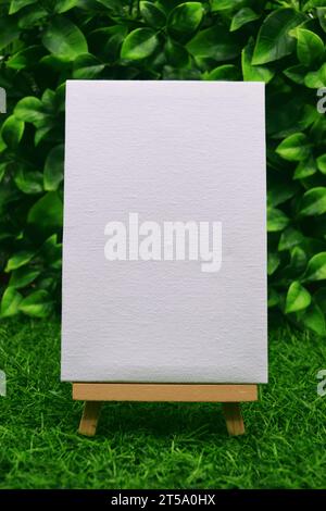 Mini Canvas on Easel with Garden Backdrop Stock Photo