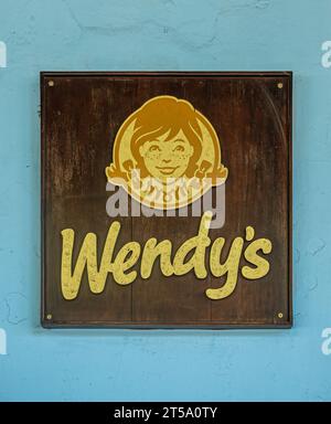 Guatemala, La Antigua - July 20, 2023: Closeup, Sign in front of Wendy's restaurant, west side of Plaza Mayor Stock Photo