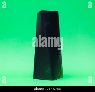 modern bluetooth speaker .isolated on green background small bluetooth speaker Stock Photo