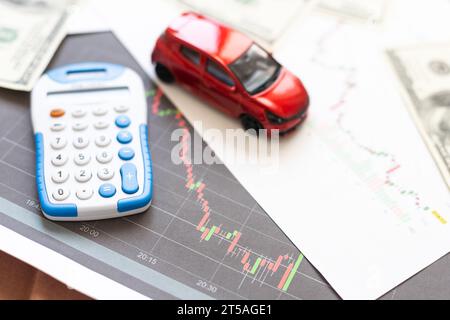 Toy car, money, documents and calculator on table. Car insurance concept Stock Photo