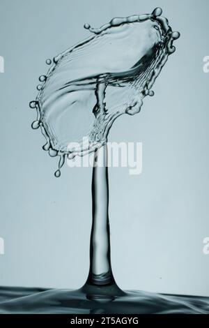 two drops of water collide and cause a splash with crown and spikes Stock Photo