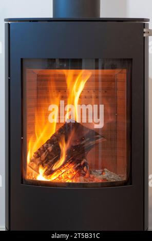 Rais Wood Burning Stove with Secondary burn and Large Log Burning with Red and Yellow Flames Stock Photo