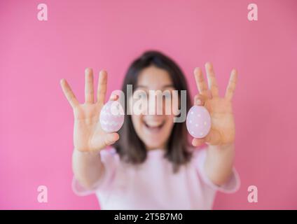 Happy woman holding easter eggs Stock Photo