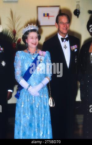 A smiling Queen Elizabeth II with The Duke of Edinburgh at a State occasion in Barbados. 1989 Stock Photo