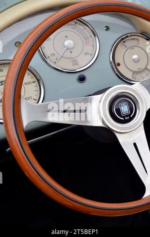 classic car wood rimmed steering wheel and dashboard dials earsham norfolk england Stock Photo