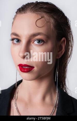 blonde lady looking at camera with red lips Stock Photo