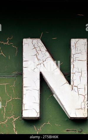 capital letter N in paint flaking shop front facade name bungay suffolk england Stock Photo