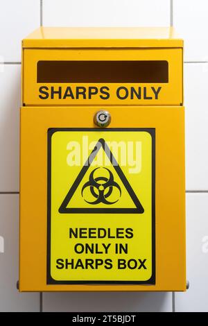 Sharps bin for disposing safely of needles Stock Photo