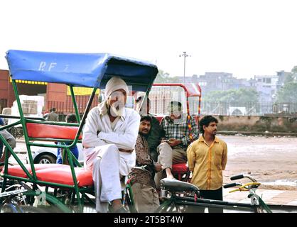 New Delhi, India - November 13, 2022: View to crowded street with rickshaws of old Delhi in India. Stock Photo