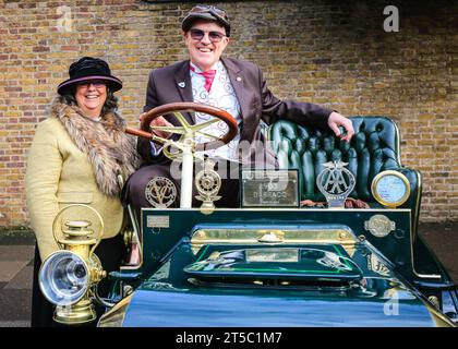 London, UK. 04th Nov, 2023. The proud owners with their 1903 Darracq. Over one hundred pre-1905 veteran cars are on display in the showcase event next to James's Palace, previewing the RM Sotheby's London to Brighton Run on Sunday. Credit: Imageplotter/Alamy Live News Stock Photo