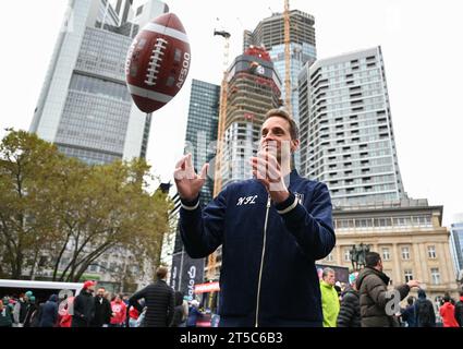 04 November 2023, Hesse, Frankfurt/Main: American Football: NFL, Before the season game Kansas City Chiefs - Miami Dolphins. Alexander Steinforth, General Manager of the NFL Germany, catches a football during a press conference. Photo: Arne Dedert/dpa Stock Photo
