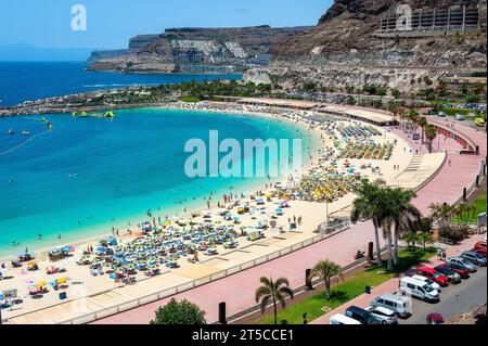 GRAN CANARIA, SPAIN - AUG 04, 2023: Playa de Amadorus is one of the most popular beaches on Canary Island Gran Canaria. Stock Photo