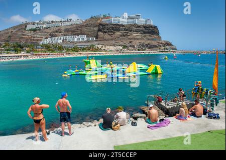 GRAN CANARIA, SPAIN - AUG 04, 2023: Playa de Amadorus is one of the most popular beaches on Canary Island Gran Canaria. Stock Photo