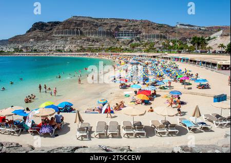 GRAN CANARIA, SPAIN - AUG 04, 2023: Playa de Amadorus is one of the most popular beaches on Canary Island Gran Canaria. Stock Photo