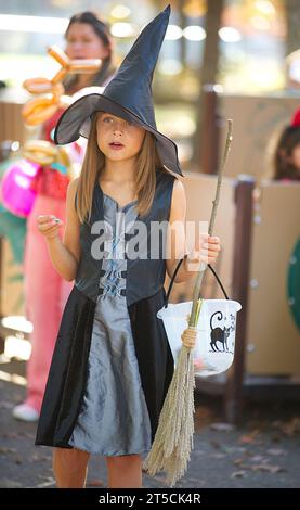 Halloweenpalooza - Dennis, Massachusetts on Cape Cod.  A family celebration of Halloween. Young girl in a witch costume, Stock Photo