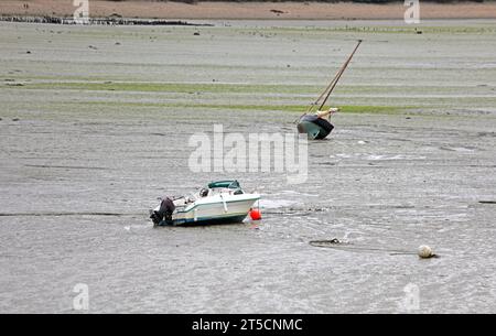 Stranded boats on the seabed during low tide in the town Cancale in France without people Stock Photo