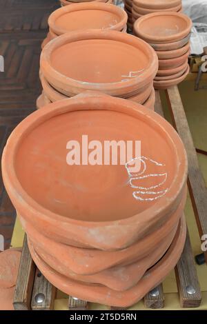 004 Traditional unglazed pottery for baking flat bread, market stall in the Pazari i Ri-New Bazaar, Old Town. Tirana-Albania. Stock Photo